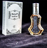 Perfume bottle and packaging with 'Maryam' branding on a dark background